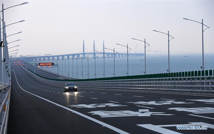 Xinhua Headlines: World's longest cross-sea bridge opens, integrating China's Greater Bay Area