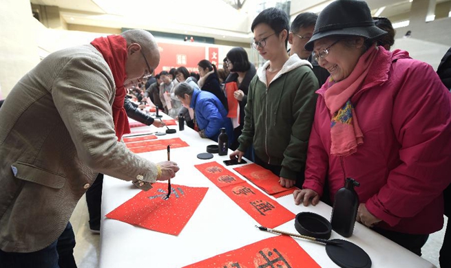 Calligraphers write Chinese character "fu", Spring Festival couplets in Hangzhou