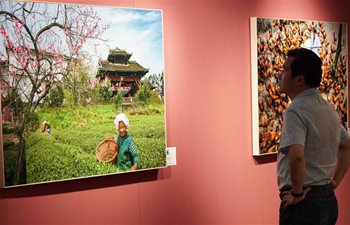 Photo exhibition themed poverty alleviation held in Beijing